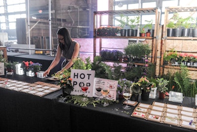 Riffing off the plant theme, the design and fabrication firm Hot Pop Factory hosted a D.I.Y. flower-pressing station. Guests used custom laser-cut flower presses to create keepsake pieces of art.