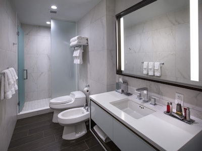 Our Lexington Avenue hotel’s Club Premier bathrooms feature granite countertops and luxurious walk-in showers.