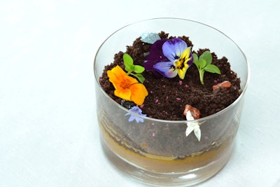 Dessert was an edible terrarium. The dish contained chocolate mousse, mango cake 'dirt,' pink guava sorbet, and chocolate rocks.