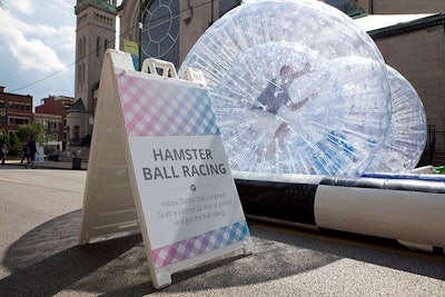In one area, employees stepped into massive spheres to compete against one another at 'Hamster Ball Racing.'