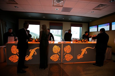 The event had a 'Metamorphosis' theme inspired by the aquarium's current exhibition: 'Amphibians.' Event Creative designed a custom bar that featured glowing salamanders.