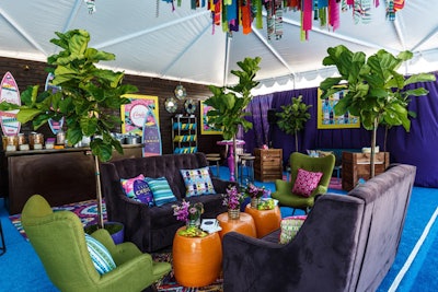 Greenery around seating groups helped make the tented space feel airy and lively.