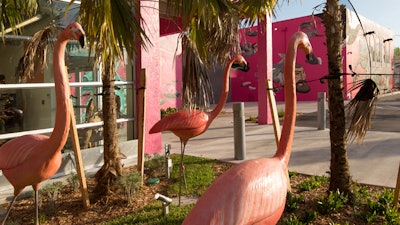You will be greeted by three 8 foot tall flamingos.