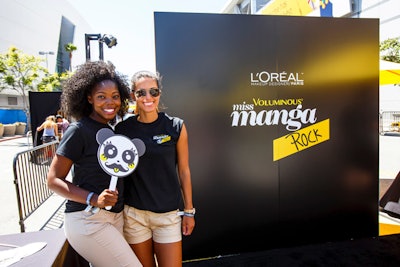 The black and yellow L’Oreal Paris activation was inspired by the packaging of the beauty brand's new product and featured a mascara beauty station on one side with a step-and-repeat mirrored wall with brand messaging phrases for selfies. After guests touched up, they could make 15-second commercial-like videos on the other side of the activation for social sharing.