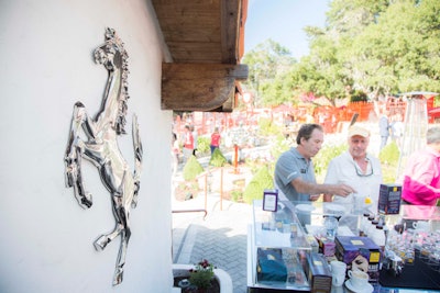 The automaker sought to insert some additional branding elements while covering up the general store's existing signage. To wit, Ferrari's iconic cavallino 'prancing horse' insignia was placed on one wall.