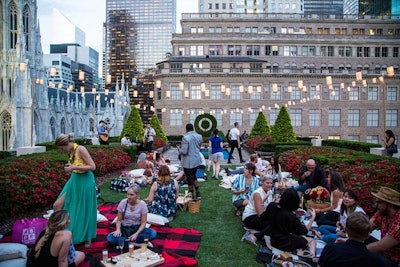 Guests were encouraged to chat and enjoy their beverages and hors d'oeuvres picnic-style on plaid blankets from the collection, while listening to jazz music from a three-man band.