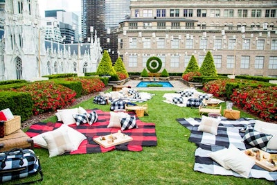 David Stark Designs set up the rooftop garden as a picnic using Adam Lippes blankets, pillows and travel bags, and also added woven baskets and charcuterie platters.