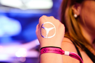 Guests at this year's Mercedes-Benz Evolution Tour, which includes stops in New York, Chicago, Los Angeles, Atlanta, and Austin, sported metallic tattoos with the car brand's logo and more.