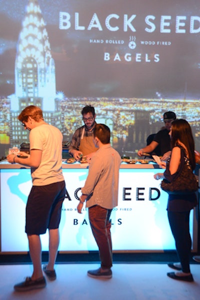 A projection of the Chrysler building shone behind the setup for New York's Black Seed Bagels.