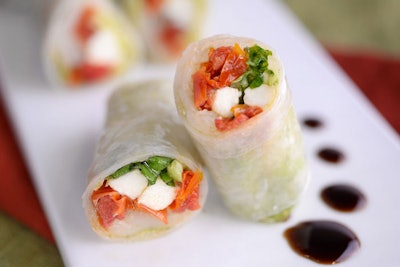 Italian Caprese summer roll with Napa cabbage, fire-roasted tomato, pesto, mozzarella, and balsamic reduction, by Puff ’n Stuff Catering in Orlando
