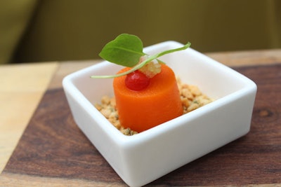 Thai coconut carrot bite with finger lime caviar, red pepper puree, coconut mousse, toasted cashew, and micro cilantro, by Stephen Starr Events in Miami