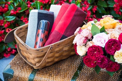 Picnic baskets held Adam Lippes blankets and thermoses.