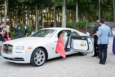 Rolls-Royce returned for the second year as a corporate sponsor of the benefit, this time bringing to the Hamptons its special 'Inspired by Fashion' edition Wraith coupe. While the model that rested inside the vehicle was not technically part of the center's installation of artworks, her repose was meant to blend into the scene as an organic inspiration.