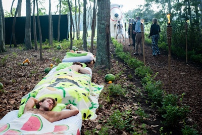 Puerto Rican artist Radames (Juni) Figueroa's 'Bed Paintings' installation featured a row of young men asleep in beds along the path of the forest, the artist's figure draped over their bodies (a tropical canvas as bed sheet). Piles of tropical fruit, meanwhile, studded the forest floor.
