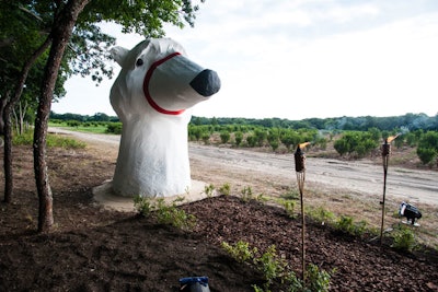 Flanking the fluorescent arches down a narrow pathway in the forest was Inga Aleknavičiute's 'White Bears' installation: two towering polar bears that marked the beginning and end of the Watermill Center's back path, seeming to guard the sunset orchard behind. The first said 'Hello' and the last, 'Goodbye.'