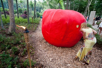 Continuing the theme of sleep and fruit throughout the event was Shay Arick's 'Given' installation, in which the Israeli sculptor produced a tableaux of a man and a woman in an embrace—a pieta in lurid silver—inside a large red apple.