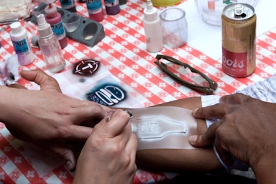 During Thrillist's 'Best Day of Your Life' event in June 2014, attendees scored airbrushed tattoos with various quirky symbols representing the brand and the festivities.