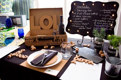 VDA Design’s setup featured a suitcase-style cork basket, along with block letters and chalkboard signage.