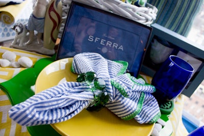 Sferra paid homage to seaside living with nautical linens and Kelly green and bright yellow dishware.