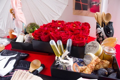 The picnic design by Mong/Todorova featured Japanese details, including a paper umbrella and cherry blossom linens, along with a centerpiece of red roses.