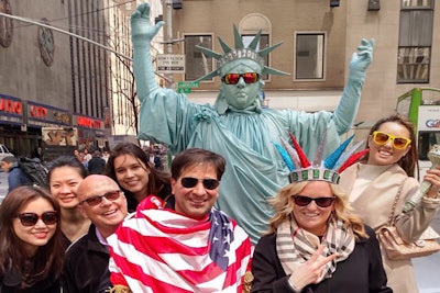 Team members find a Statue of Liberty on a corporate hunt in New York.
