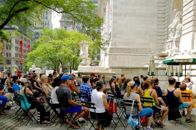 Crowds of 70 to 90 people gathered in Bryant Park to practice mindfulness as part of the Ziva Meditation series. Sessions included breath work, a short silent meditation, and guided visualization.