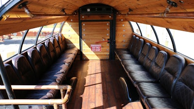 The copper handrails, beautiful seats, and warm illumination provide a truly elegant ride