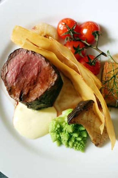 The main course will be a filet of beef tenderloin with herb-scented potato terrine, king trumpet mushrooms, yucca chips, roasted cherry tomatoes, red wine jus, and béarnaise espuma.