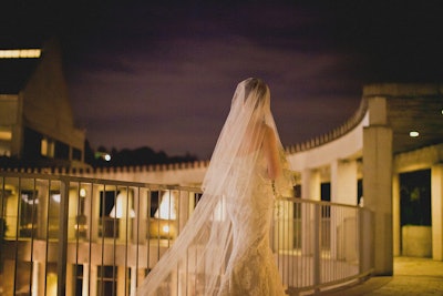 Dreamy bridal walk in the unique architectural setting of Taper Courtyard. Photo by Montana Dennis.