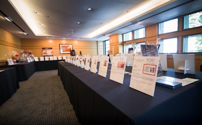Clean architectural lines compliment this silent auction setup adjacent to Ahmanson Hall. Photo by Bebe Jacobs.