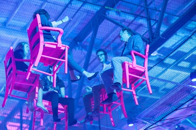 To force attendees out of their comfort zones, organizers invited them to participate in discussions while suspended 18 feet in the air.