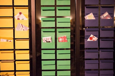 Guests created greetings for active military members at a card-making station at a wonderland-theme holiday party, held at 26 Bridge in December 2014 and designed by New York-based event firm Rock Paper Scissors Events.
