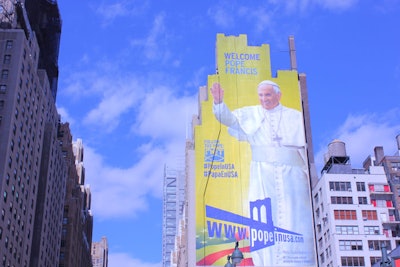 To promote Pope Francis's visit to New York, a 225-foot-tall mural of the pope that was painted by artist Van Hecht-Nielsen debuted earlier this month outside of Penn Station and Madison Square Garden.