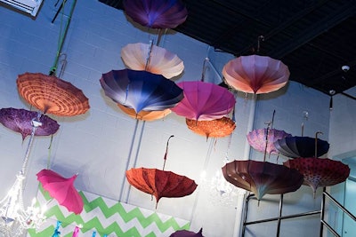 For the Cirque du Soleil-style holiday party for Traffic Control Services, held at its corporate office in Hummelstown, Pennsylvania, in December 2014, JDK Group used eccentric elements like colorful hanging parasols and inflatable furniture by Cort Event Furnishings to transform the room.