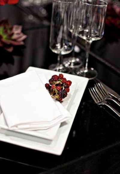 'We love a beautiful, yet simple, red holiday berry as an added touch to the napkins on a tablescape,' Wilson says.