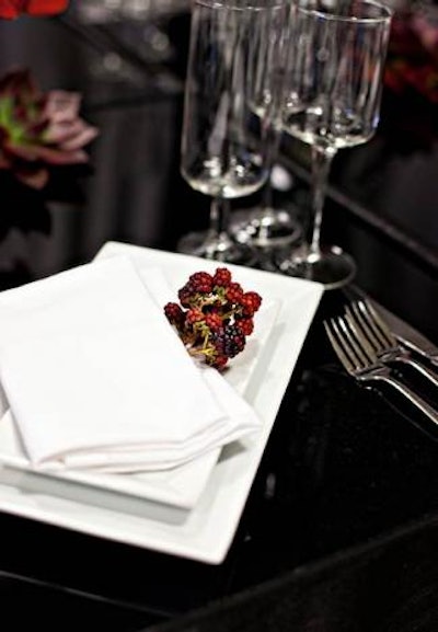 'We love a beautiful, yet simple, red holiday berry as an added touch to the napkins on a tablescape,' Wilson says.