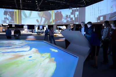 In the center of Sapphire Now’s Innovation Showcase, SAP demonstrated its work with airline and shipping companies. As attendees used touch screens to select data from clients such as John Deere and Lufthansa, their choices powered images on both the digital world map in front of them and also on the screens that wrapped around the space.