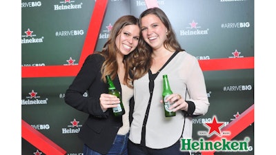 Step and repeat photo activity with branded onsite photo prints and social media for Heineken's new bottle launch.