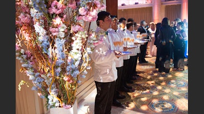 Cocktail Hour at 2015 HealthCorps Gala with floral arch in foreground