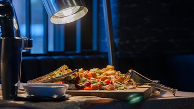 Chicken Paillard on Large Carving Board as Buffet Item