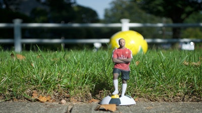 August Soccer Figurine on Soccer Ball Base