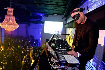 DJ Arkitek entertained guests from a sky box in front of a 30-foot video wall, which had been custom designed for the event.