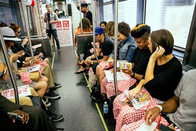 On their seats, guests find gift bags filled with Uniqlo products and Japanese snacks such as 'Hello Panda' Meiji cookies.