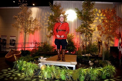 The evening also included a group singing of the the national anthem, 'O Canada.' A Mountie (a member of the Royal Canadian Mounted Police), saluted the country's flag while guest sang and later mingled with guests.