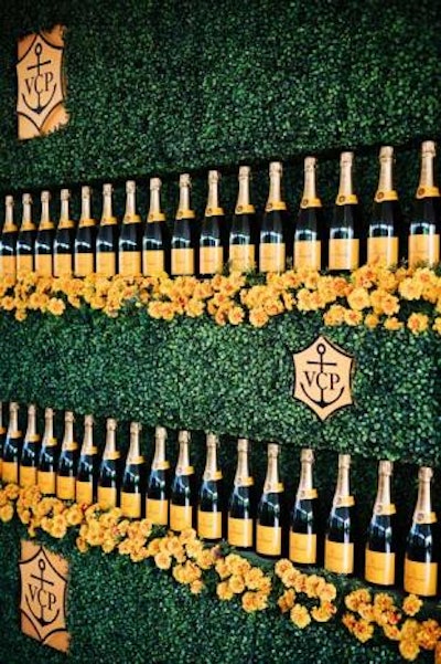 Bottles decorated a logo wall for photos.