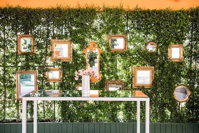 Mirrors in opulent gold frames decorated a gallery wall.