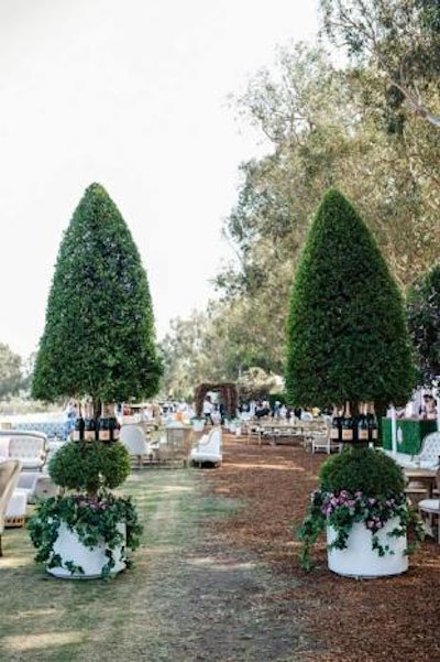 Bottles decorated topiaries surrounding the Rosé Garden.