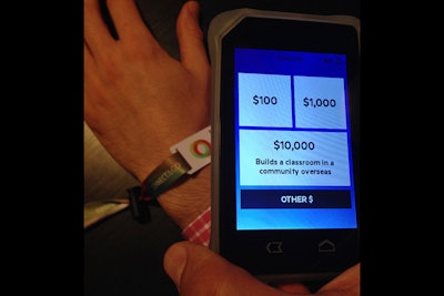 Event staff scan guests' wristbands to record their donations. The system then automatically emails an invoice to the guest.
