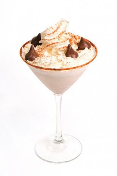 The seasonal Pumpkin Soufflé Martini at the Sugar Factory American Brassiere features Stoli vanilla vodka and Godiva white chocolate liqueur and is garnished with a pinch of pumpkin pie spice, whipped cream, and pumpkin-spice-flavored Hershey's Kisses.