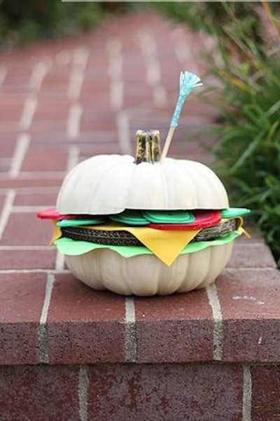 A hamburger pumpkin from Shrimp Salad Circus includes 'lettuce, tomato, and cheese' made from corrugated cardboard, foam, and heavy paper.